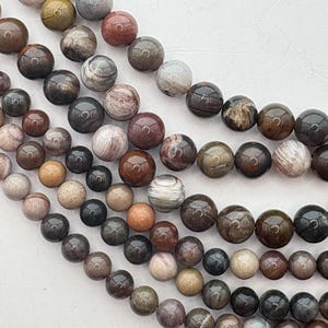 Petrified Wooden Agate Gemstone Beads.  15” strand of high quality round beads, available isn 6.5mm and 8.5mm.