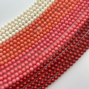 8mm Bamboo Coral gemstone beads.  Available in 4 colors: white, pink, orange and red.