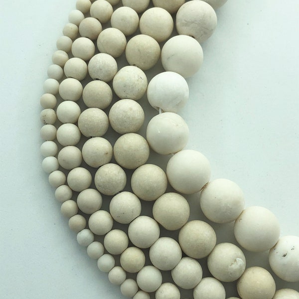 Matte River Stone gemstone beads, available in 4-12mm. 15" strands of round Fossil Stone beads. Finely crushed fossilized shells.