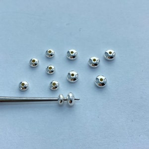 Saucer shaped  9.25 Sterling Silver beads. Available in 3mm, 4mm and 5mm. 10 piece packages. Excellent spacers.