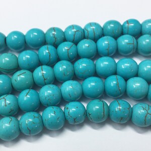 Turquoise Dyed Magnesite Gemstone Beads. 8mm round beads on 15 inch strand. Full strand of beads, about 48 per strand. Imitation Turquoise