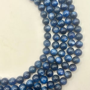 8mm high quality Kyanite beads.  15” strand of beautiful round, blue Kyanite.