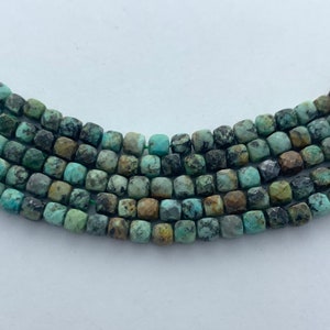 4mm faceted cube African Turquoise gemstone beads. 15” strand of precision cut cubes, approx. 100 beads per strand.