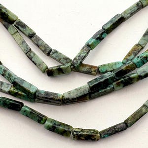 African Turquoise 4x13mm rectangle shaped beads. 15” strand of cuboid beads, 29 beads per strand.