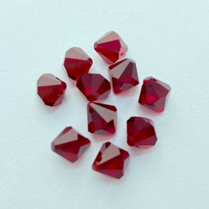 Top Drilled Siam 8mm Bicone SWAROVSKI® Crystal Beads, package of 10. Dark Red Genuine Austrian Crystal. #6328. July Birthstone