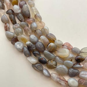 8-12mm Botswana Agate nugget gemstone beads. 15” strand of agate nuggets, approx. 41-44 per strand. Size and shape varies. Grey Agate.
