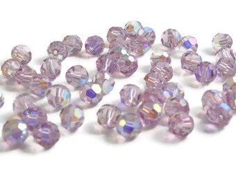 6mm Round Light Amethyst AB SWAROVSKI® Crystal Beads #5000 - purple crystal with a rainbow finish. Discounted pricing.