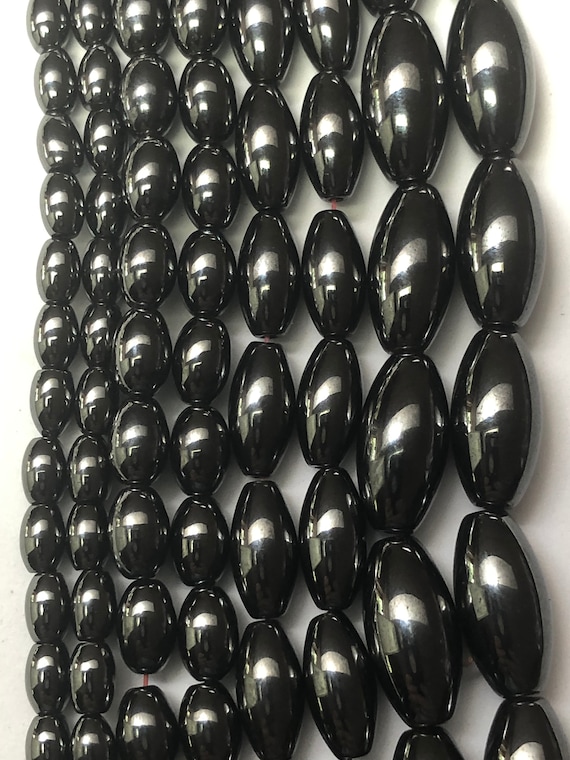 Rice Shaped Magnetic Hematite Gemstone Beads. Full 15" strand of oval AAA grade beads, available in 4 sizes. Magnetite.