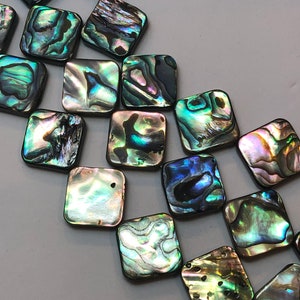 14mm Diamond Shaped Abalone Shell Beads. Full 15&quot; strand of irridescent abalone beads, about 23 beads per strand. Irridescent shell.