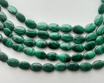 8x12mm flat oval Malachite gemstone beads. Full 15" strand of banded green Malachite beads, approx. 33 per strand.