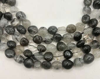 Freeform Smooth Nugget Black Tourmalated Quartz gemstone beads.  15” strand of clear Quartz and black Tourmaline, 36-38 per strand. Lot B.