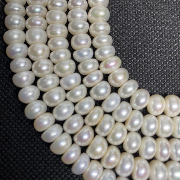 8-9mm Button/Rondelle Freshwater Pearl Beads.  16" strand of cream/ivory pearls, approx. 70 beads per strands.