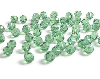 6mm Round Erinite SWAROVSKI® Crystal Beads #5000 - dusty green color genuine Austrian crystal bead. Discounted prices.