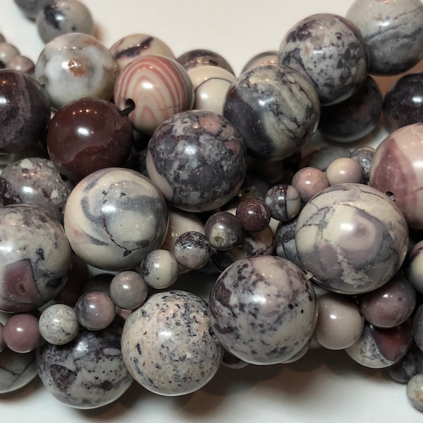 Porcelain Jasper Gemstone Beads. 4-12mm round beads on 15 inch strand. Full strand High Quality AAA grade. Purple, cream, grey & pink stone.