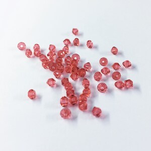 Padparadscha 3mm Bicone SWAROVSKI® Crystal Beads #5301 package of 50. Coral Pink color Genuine Austrian Crystal. Bulk. #5328. Orange