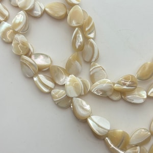 10x14mm Mother of Pearl flat teardrop/pear gemstone beads. 15” strand of shell teardrops, 30 beads per strand.