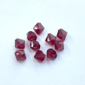 Top drilled Siam 6mm Bicone SWAROVSKI® Crystal Beads, package of 10. Dark Red Genuine Austrian Crystal. #6328. July Birthstone.