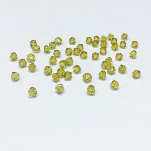 Lime 4mm Bicone SWAROVSKI® Crystal Beads #5301 package of 50. Dark Lemon Yellow color Genuine Austrian Crystal. Bulk. #5328. Discontinued