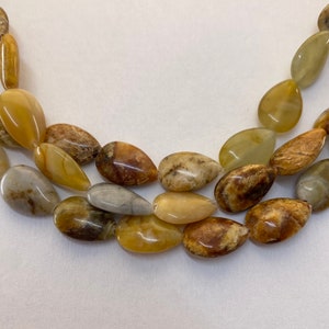 10x14mm Teardrop New Jade Gemstone Beads. 15” strand of mixed brown and yellow-green beads, 28 per strand. Rainbow Serpentine. Flower Jade.