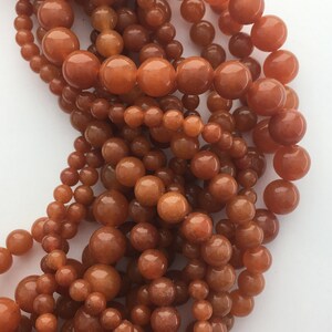Orange Aventurine gemstone beads. 15” strand of round orange beads, 4-8mm available.