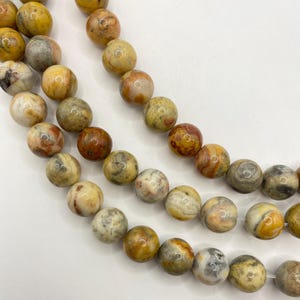 12mm Crazy Lace Agate Gemstone Beads. 15&quot; strand of high quality round beads, roughly 32 per strand. Lacey Agate.