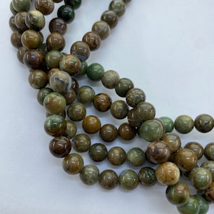 8mm African Green Opal Gemstone Beads. 15" strand of high quality round Green Opal beads, approx. 46 per strand.  Mixed greens with brown.