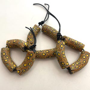 Antique Venetian Millefiori African Trade Beads. Strand of 3 “elbow” beads in excellent condition. Approx. 40-45mm in length and 12mm dia.