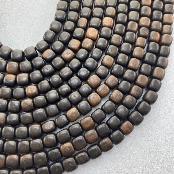 6mm Rounded Cube Black Ebony Wood Beads.  16” strands of natural wood beads, approx. 58 per strand.  Dark brown and black wood beads.