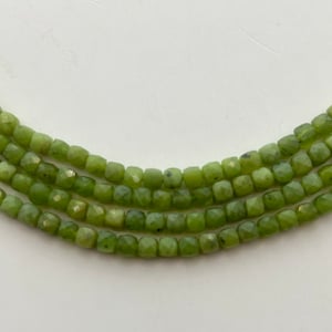 4mm faceted cube Canadian Jade gemstone beads. 15” strand of precision cut green cubes, approx. 96 per strand.