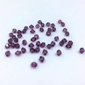 3mm Bicone Amethyst SWAROVSKI® Crystal Beads #5301 package of 50. Dark Purple Crystal Color. Bulk pricing. February Birthstone. New #5328