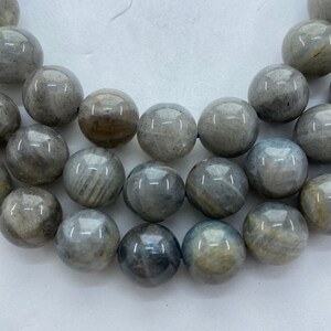 12mm Labradorite Gemstone Beads. 15” strand of round Labradorite  beads, about 32 per strand. Grey/Blue Labradorite with some flash.