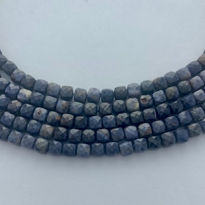 4mm faceted cube Sapphire gemstone beads. 15&quot; strand high quality beads, about 96 per strand. Opaque Blueberry blue Corundum beads.