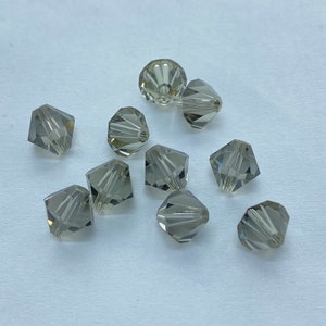 Greige 8mm Bicone SWAROVSKI® Crystal Beads #5301 package of 10. Beige color Genuine Austrian Crystal. Bulk. #5328. Charcoal grey.