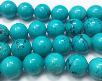 Turquoise Dyed Magnesite Gemstone Beads. 14mm round beads on 15 inch strand. Full strand of beads, about 29 per strand. Imitation Turquoise