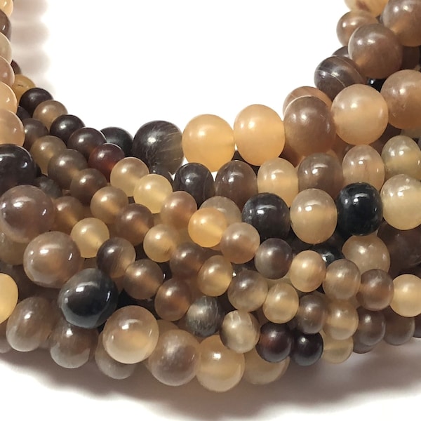 16" strand of Grey Horn Beads.  Carabao horn beads hand made in the Philippines.  Mixed browns.