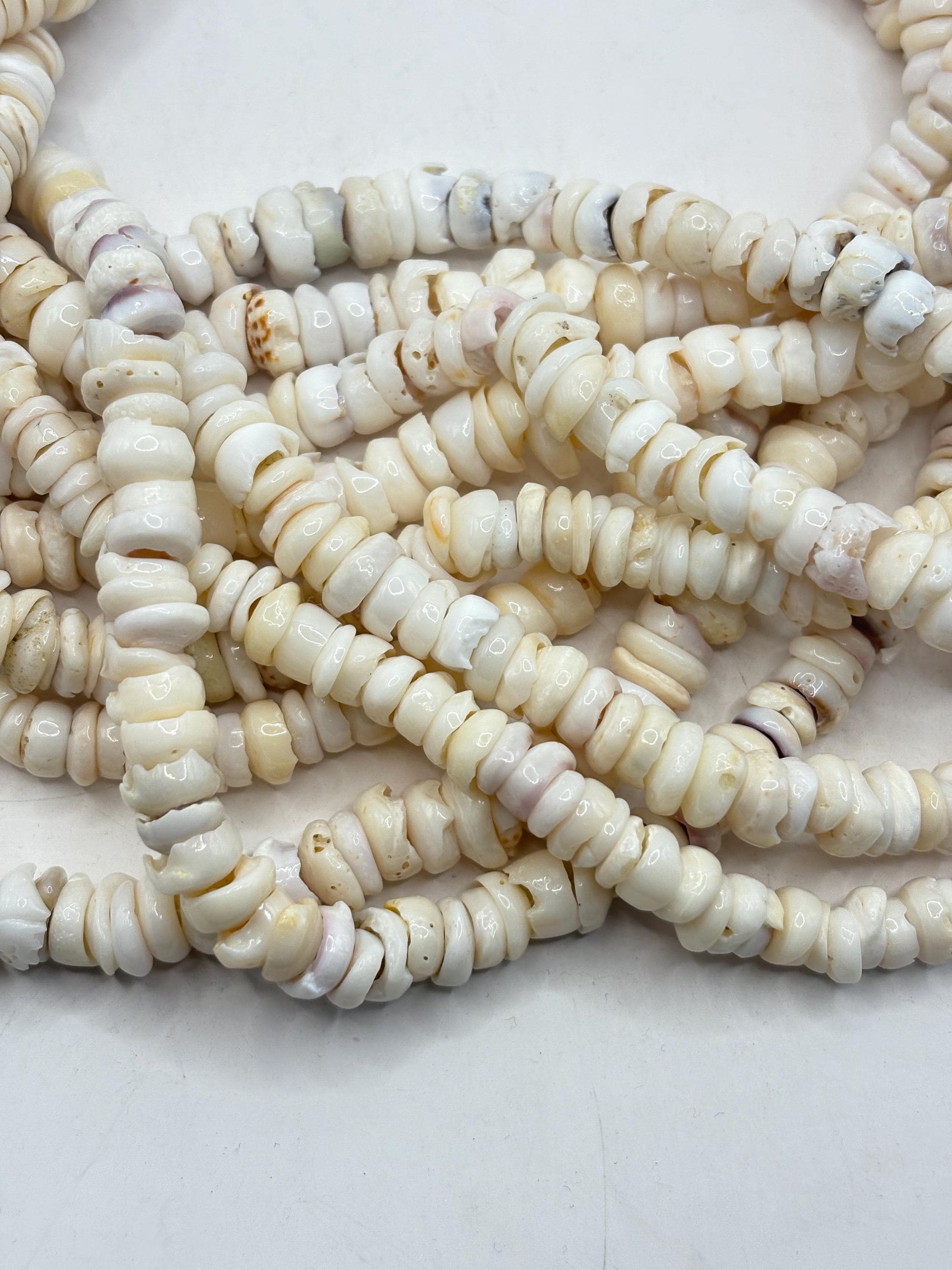 White Puka Shell Beads. 16