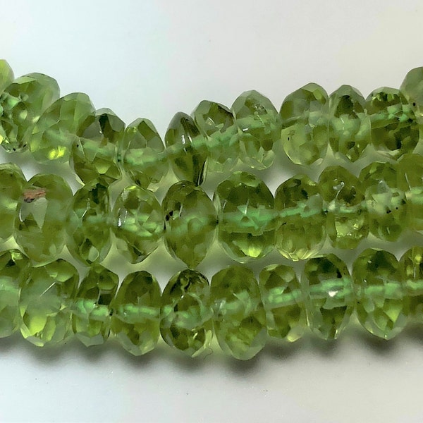 Faceted Peridot Rondelle Gemstone Beads. Full 15" strand of 6mm faceted rondelles. Slightly irregular shape. Hand-made in India.