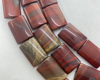 13x18mm rectangle/pillow Apple Jasper Gemstone Beads. Deep Red Jasper beads with touches of green and gray. 15” strand, approx. 22 beads.