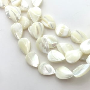 10x14mm Mother of Pearl flat teardrop/pear gemstone beads. 15” strand of white shell teardrops, 30 beads per strand.
