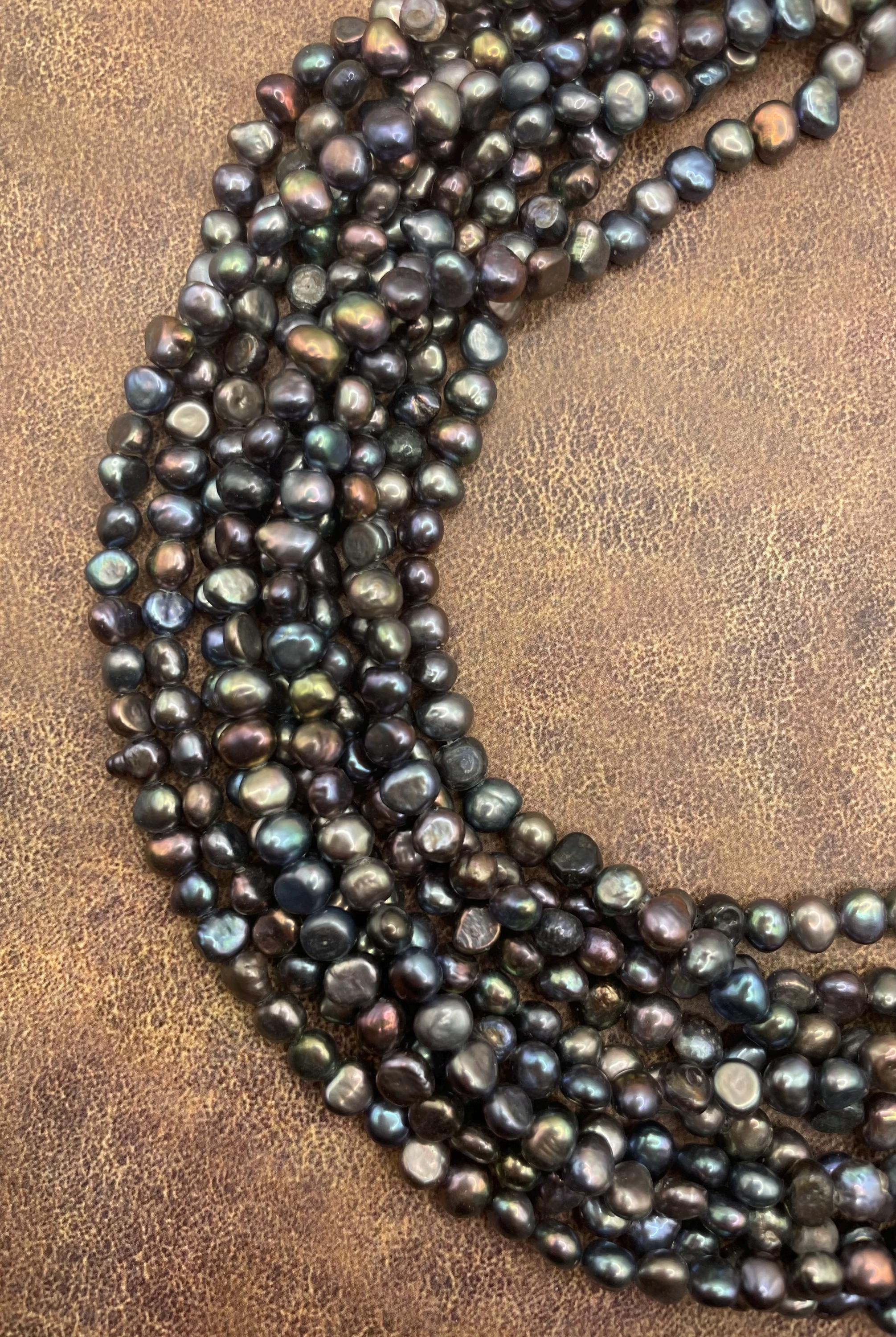 6-7mm Nugget Freshwater Pearl Gemstone Beads. 15” strand of purplish, dark grey free form pearls.