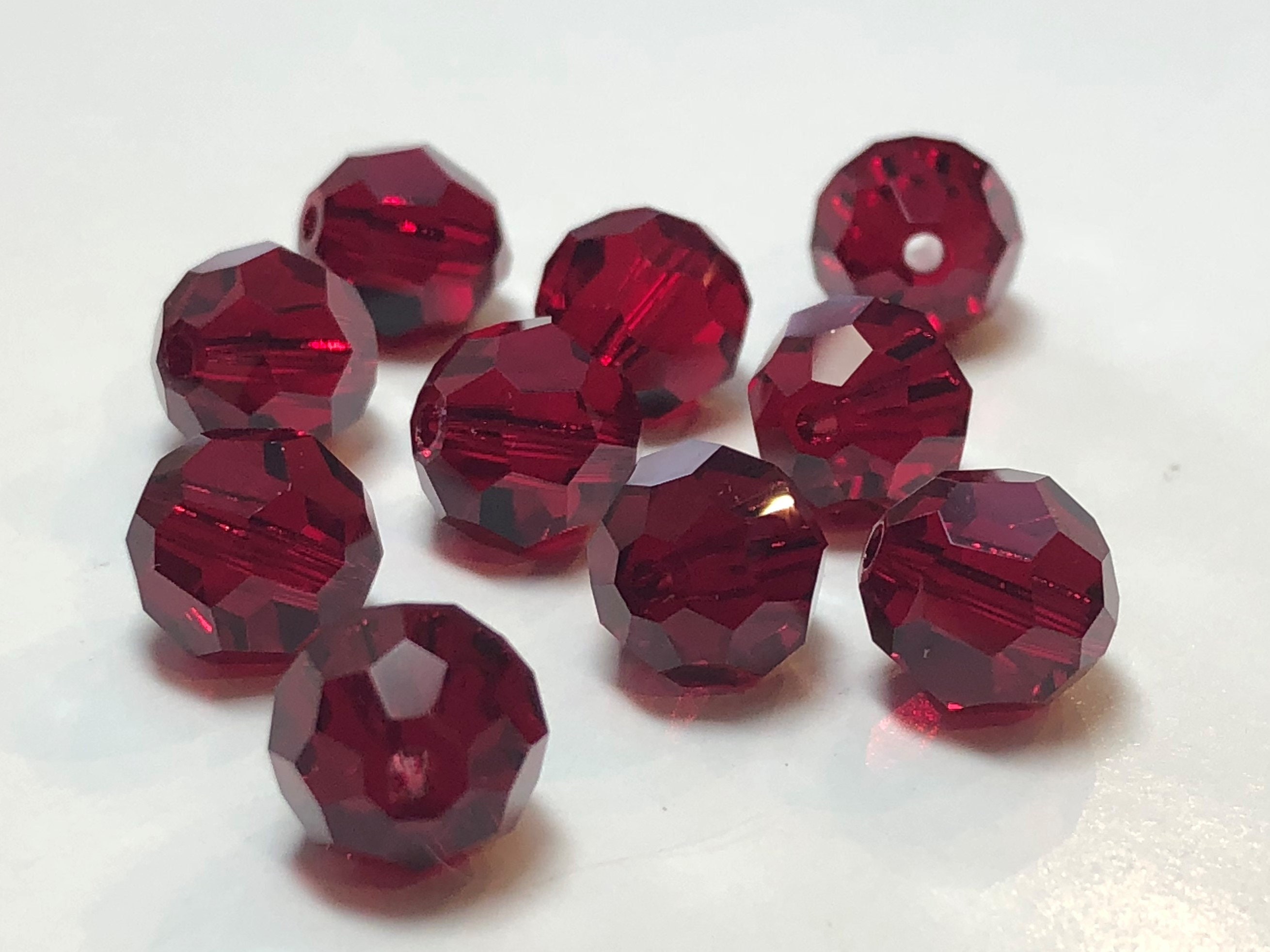 Crystal 8x10mm Light Siam Red Faceted Coin Beads - 8 inch strand