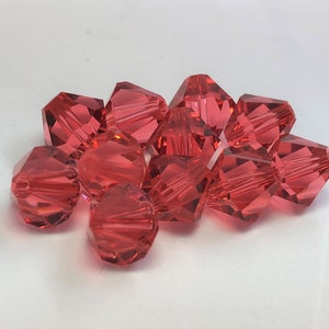 Padparadscha 8mm Bicone SWAROVSKI® Crystal Beads #5301 package of 10. Pinky Orange color Genuine Austrian Crystal. Bulk. #5328.