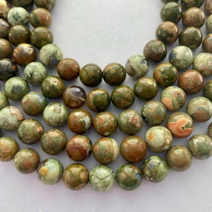 10mm Green Rhyolite Gemstone Beads. 15” strand of high quality round beads, about 38 per strand. Mix of light and dark Rhyolite. Ryolite.