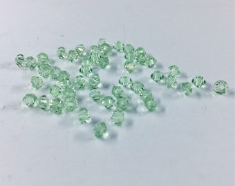 Chrysolite 3mm Bicone SWAROVSKI® Crystal Beads #5301 package of 50. Light Pastel Green color Genuine Austrian Crystal. Bulk. #5328.
