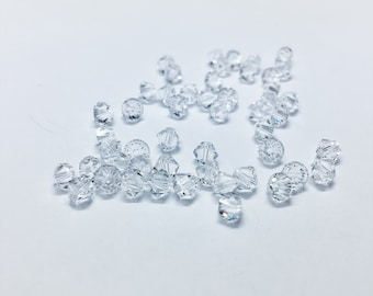 Crystal 4mm Bicone SWAROVSKI® Crystal Beads #5301 package of 50. Clear color Genuine Austrian Crystal. Bulk. #5328.