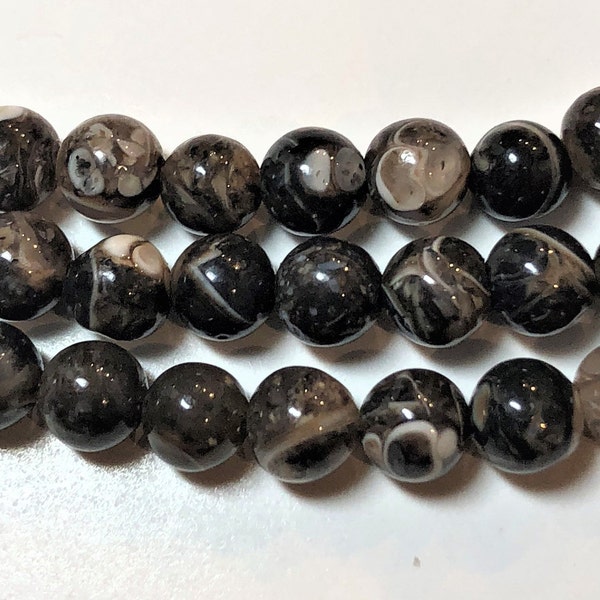 4mm Turritella Agate on full 15" strand.  Beautiful AA/AAA grade patterned Agate. Earthy black & browns due to fossilized snails in stone.