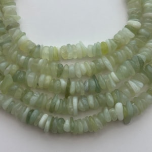Serpentine gemstone chip beads.  15" strand of 10-12mm thick chip beads. Irregular slices. New Jade.