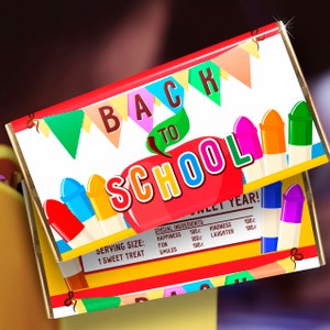 May include: Back to school chocolate bar wrapper with a red apple and colorful crayons. The wrapper says "Back to School" and "Special Ingredients: Happiness 100%, Fun 100%, Smiles 100%, Kindness 100%, Laughter 100%".