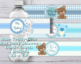 May include: Four designs of blue and white baby shower bottle labels featuring teddy bears. The labels say "Welcome Baby!" "Oh Baby!" "It's a Boy!" and "It's a Boy!" The labels are 3.3 inches by 2.0 inches.