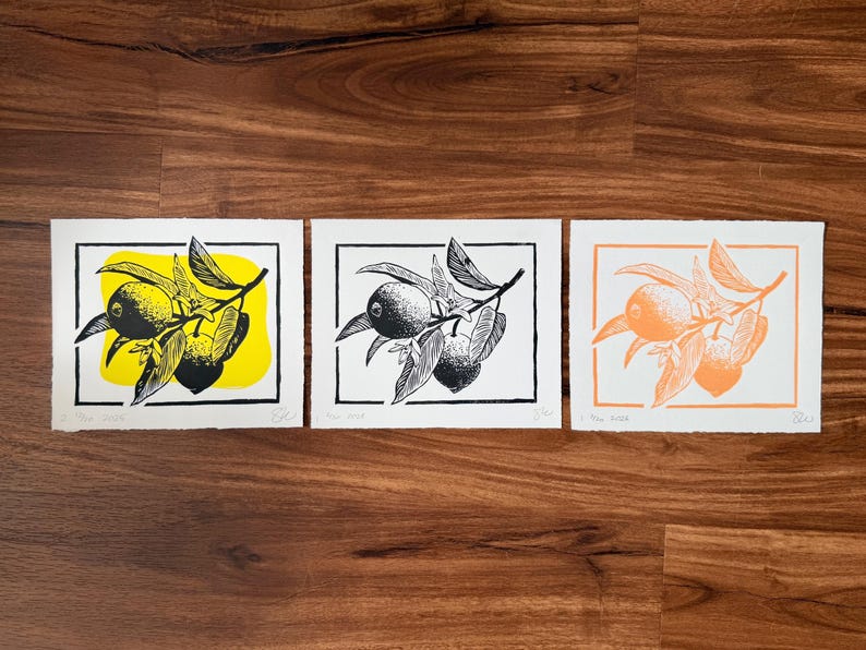 the print with two other variations. one is the lemons image in black, and the other is the lemons image in black with a yellow blob behind it.